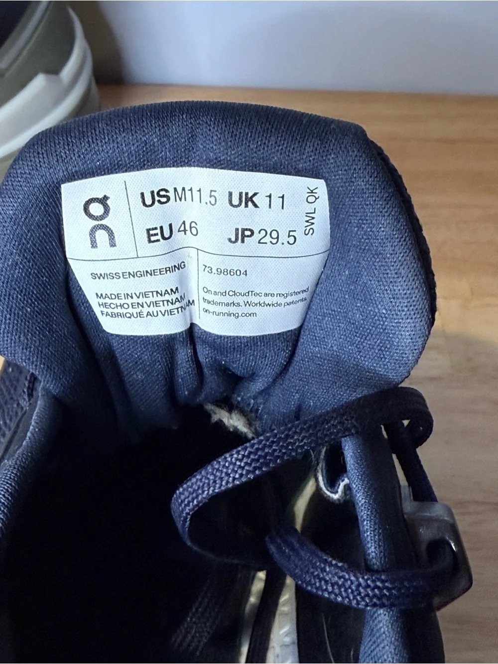 On Waterproof Men's Trail Shoes in midnight blue and Olive